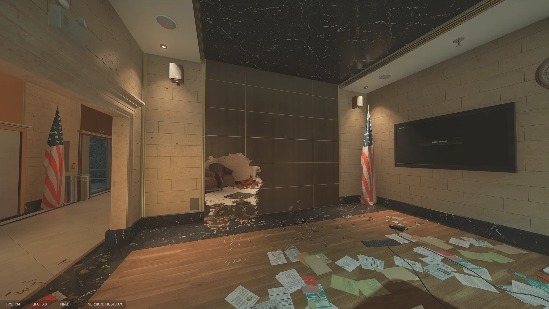 Room on Bank 2F with an American flag, a wall-mounted screen, scattered papers, and a hole through a wood-paneled wall
