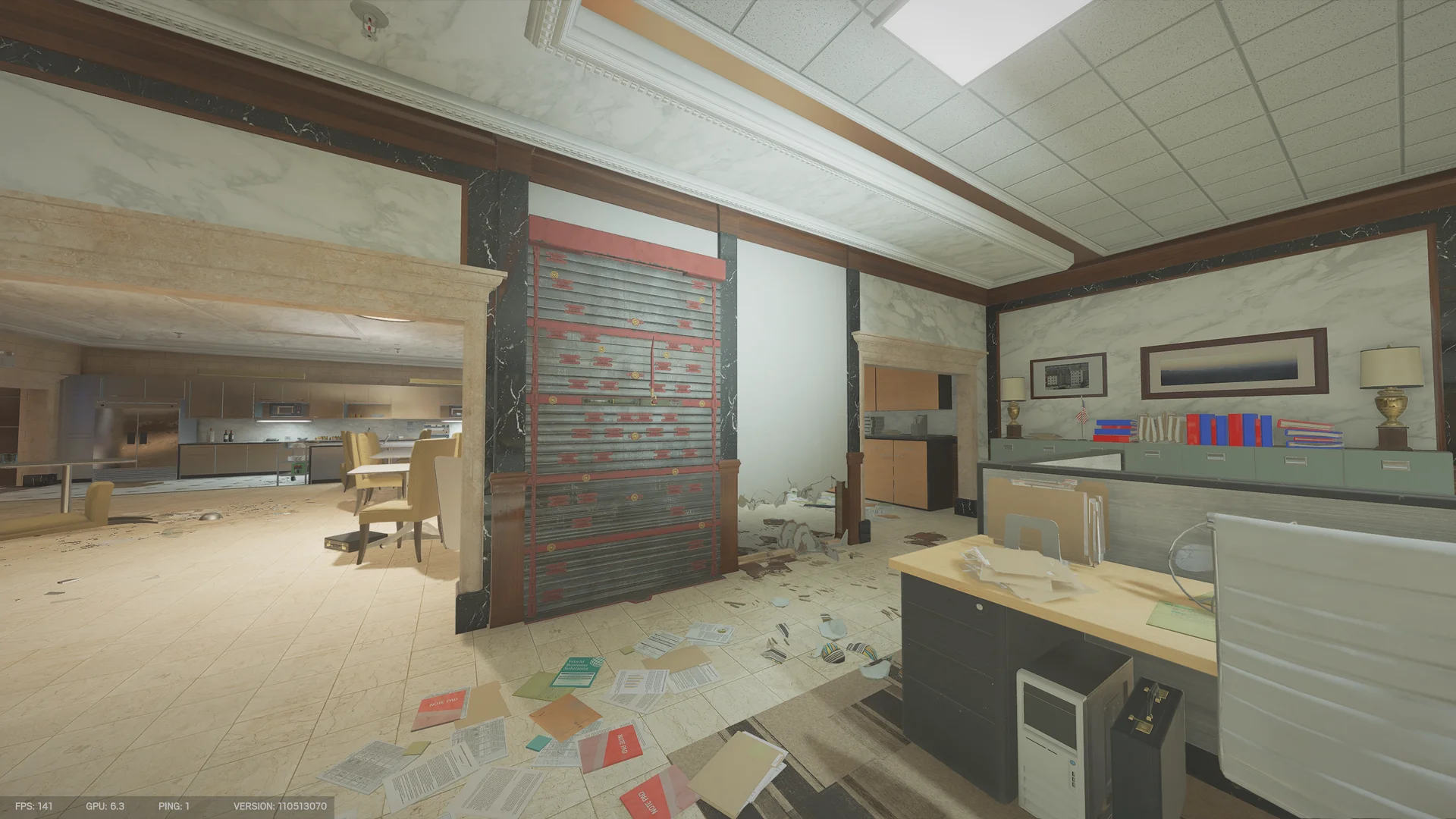 Open office on Bank with a red-and-black reinforced wall, a kitchen in the background, and papers strewn across the floor
