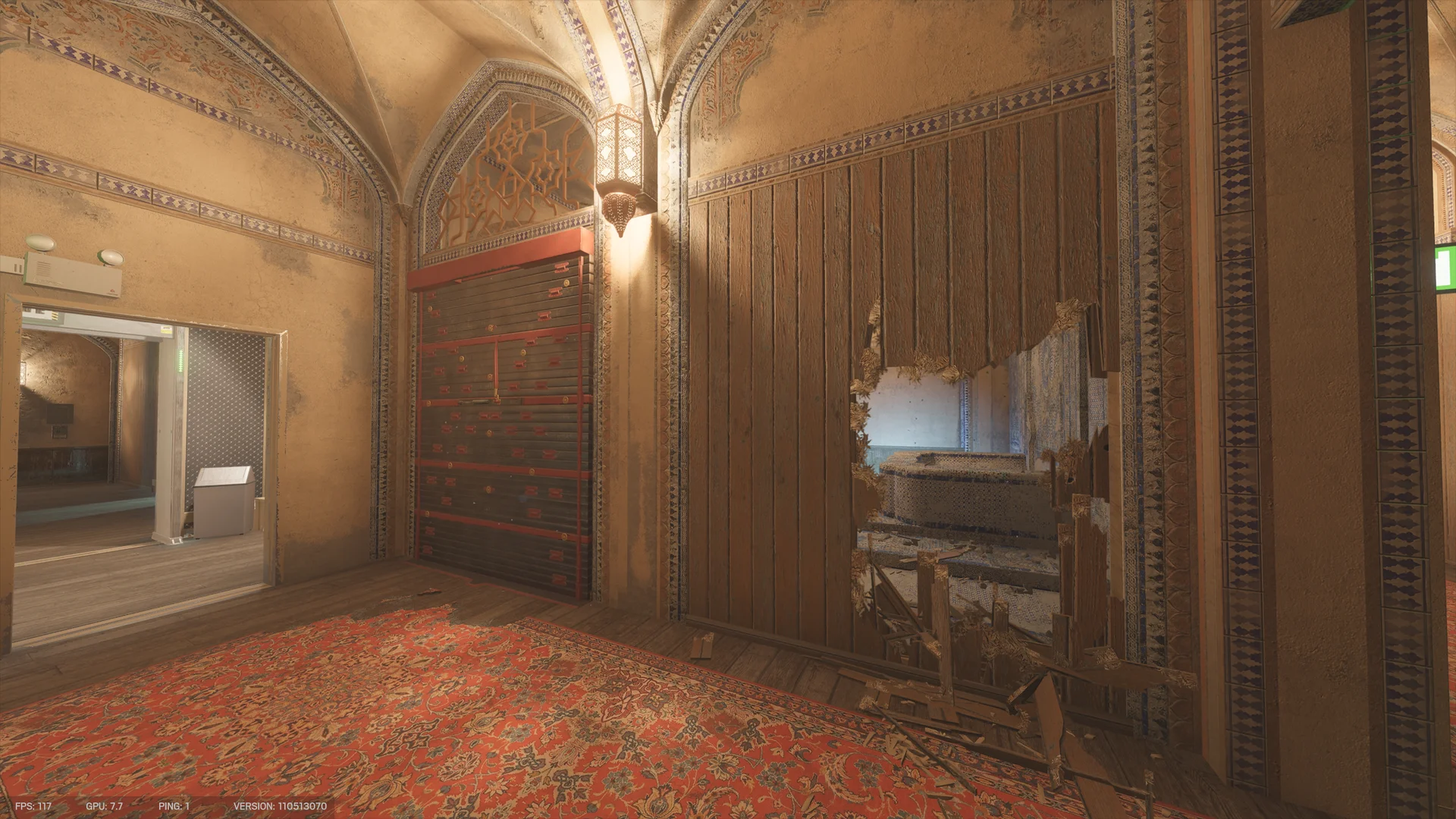 Vaulted ornate room on Border 1F with a red rug, a closed dark metal shutter, and a wooden wall broken open to a mosaic-tiled room with a raised basin