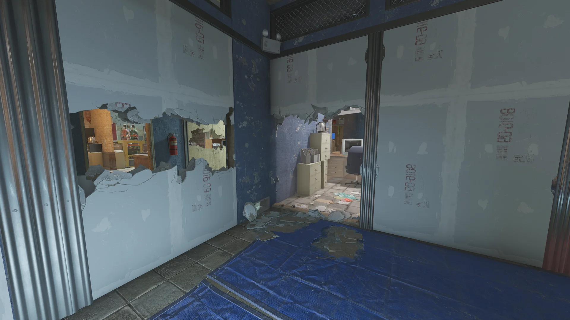Corner of torn drywall panels on Border 1F with a blue tarp on the floor, holes opening to an office with a CRT monitor, filing cabinets and a kettle