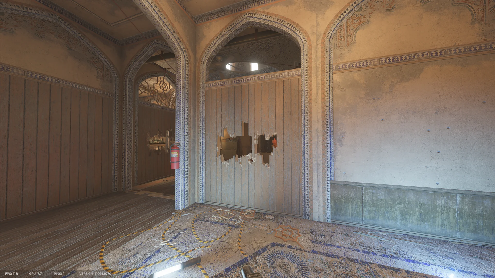 Ornate arched hall on Border 1F with a mosaic floor, black-and-yellow tape, a fire extinguisher on a pillar, and jagged holes through a wooden partition
