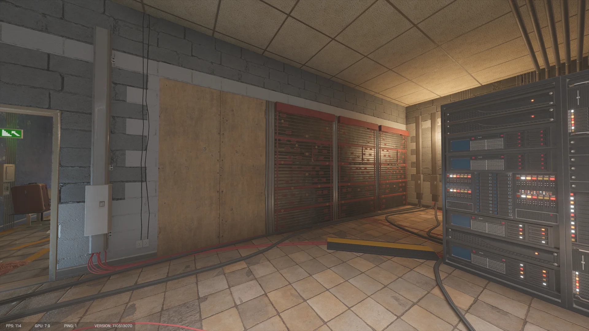 Tiled room on Border 1F with a plywood-boarded section and closed metal shutters along a blockwork wall, and a rack of electronics with lit indicators at right