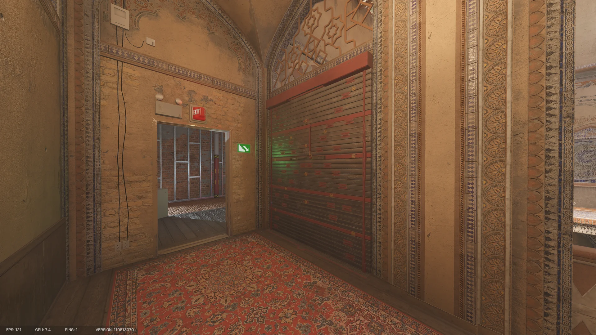Carpeted corner room on Border 2F with a closed dark metal shutter and an exit-signed doorway opening to a brick room with metal wall studs