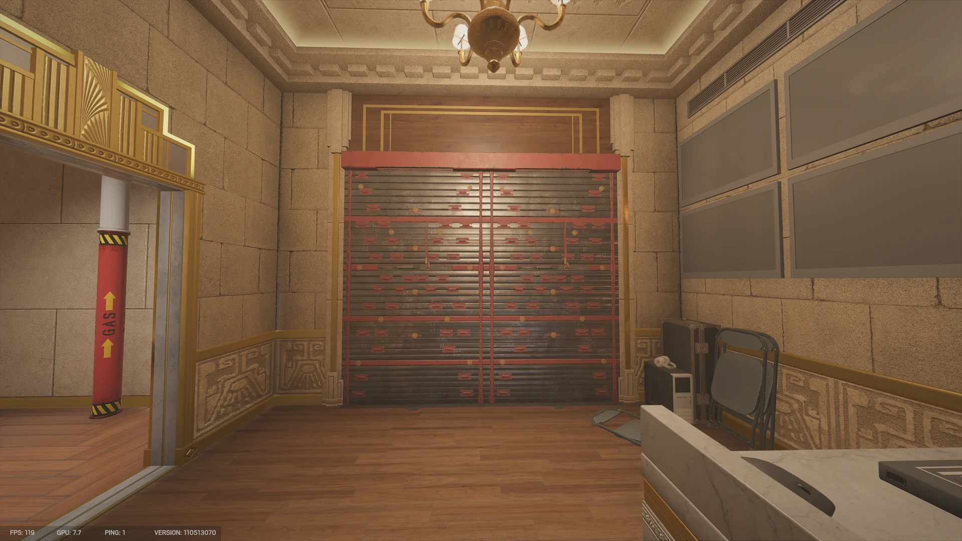 Stone room on Calypso Casino 1F with a wide reinforced wall, a red gas pipe at left, folding chairs and a marble counter