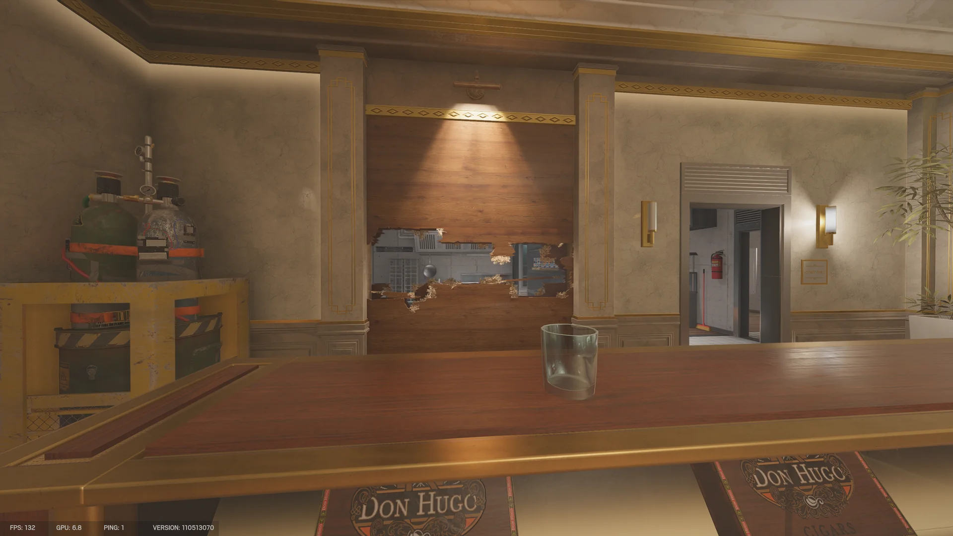 Bar counter on Calypso Casino 2F with a glass, gas cylinders on a yellow cart, and a breached wood panel showing a kitchen