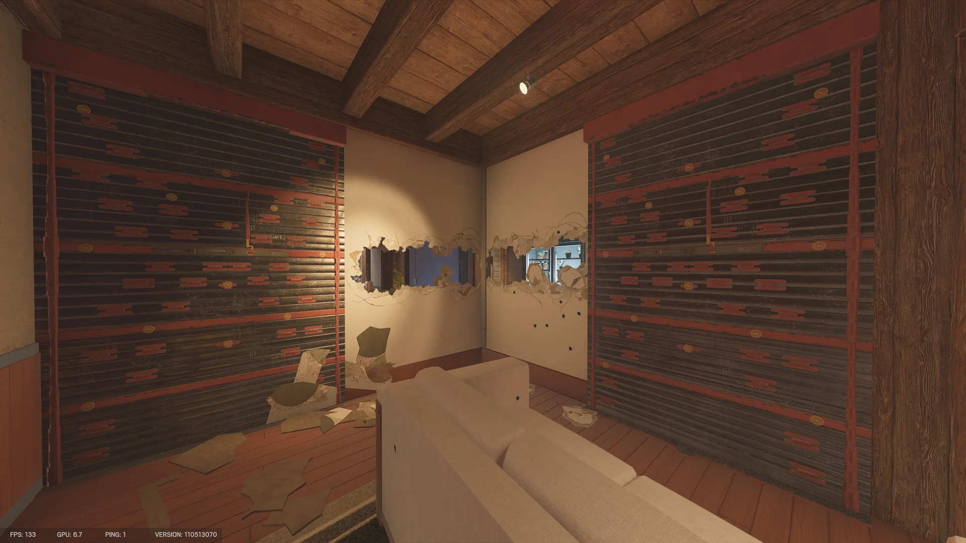 Room on Chalet 1F with two reinforced walls flanking a breached corner that reveals a kitchen fridge, a pale sofa in front