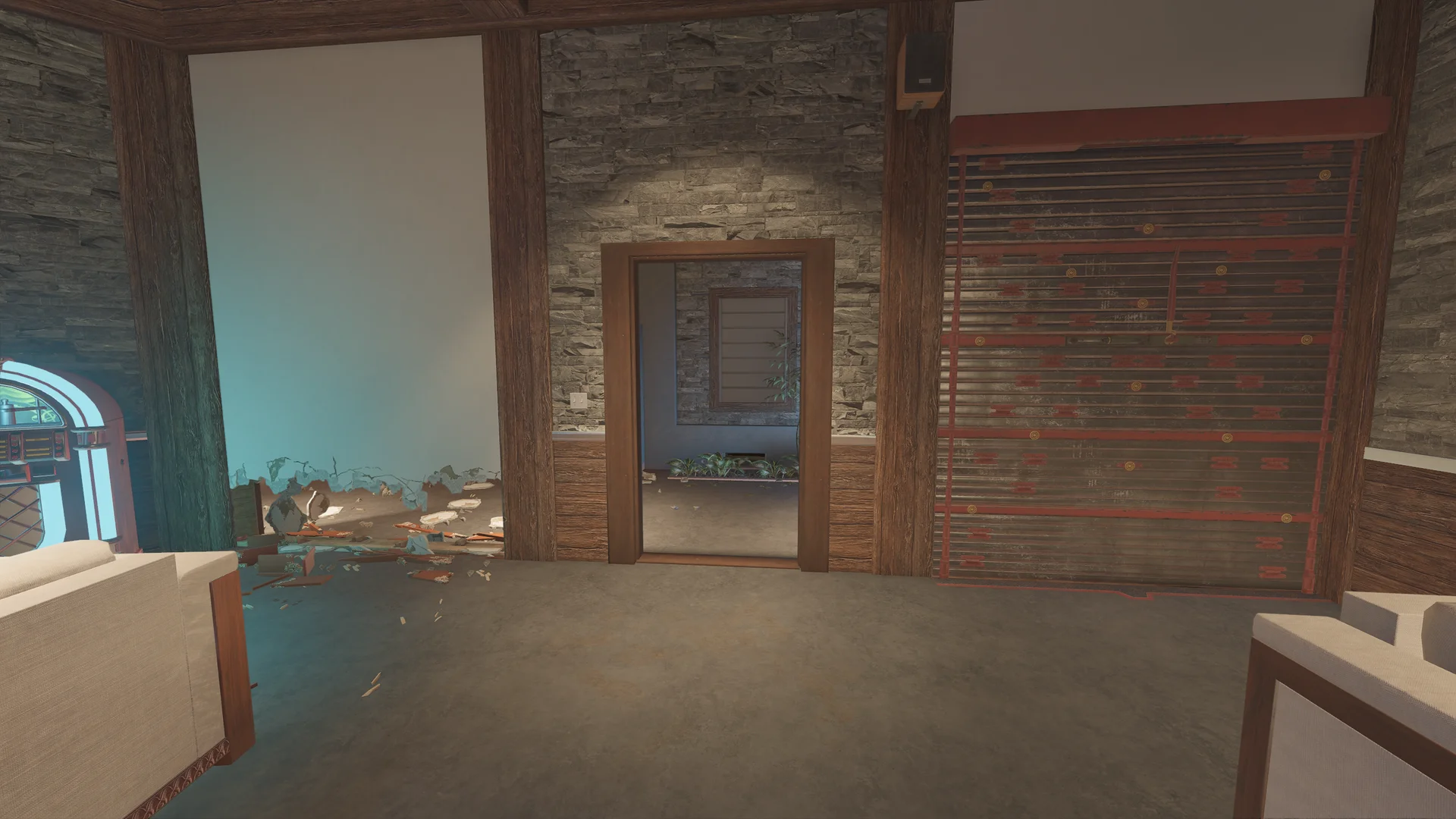 Room on Chalet 1F with a reinforced wall at right, a doorway in a stone wall, a jukebox glow and a low breach at left