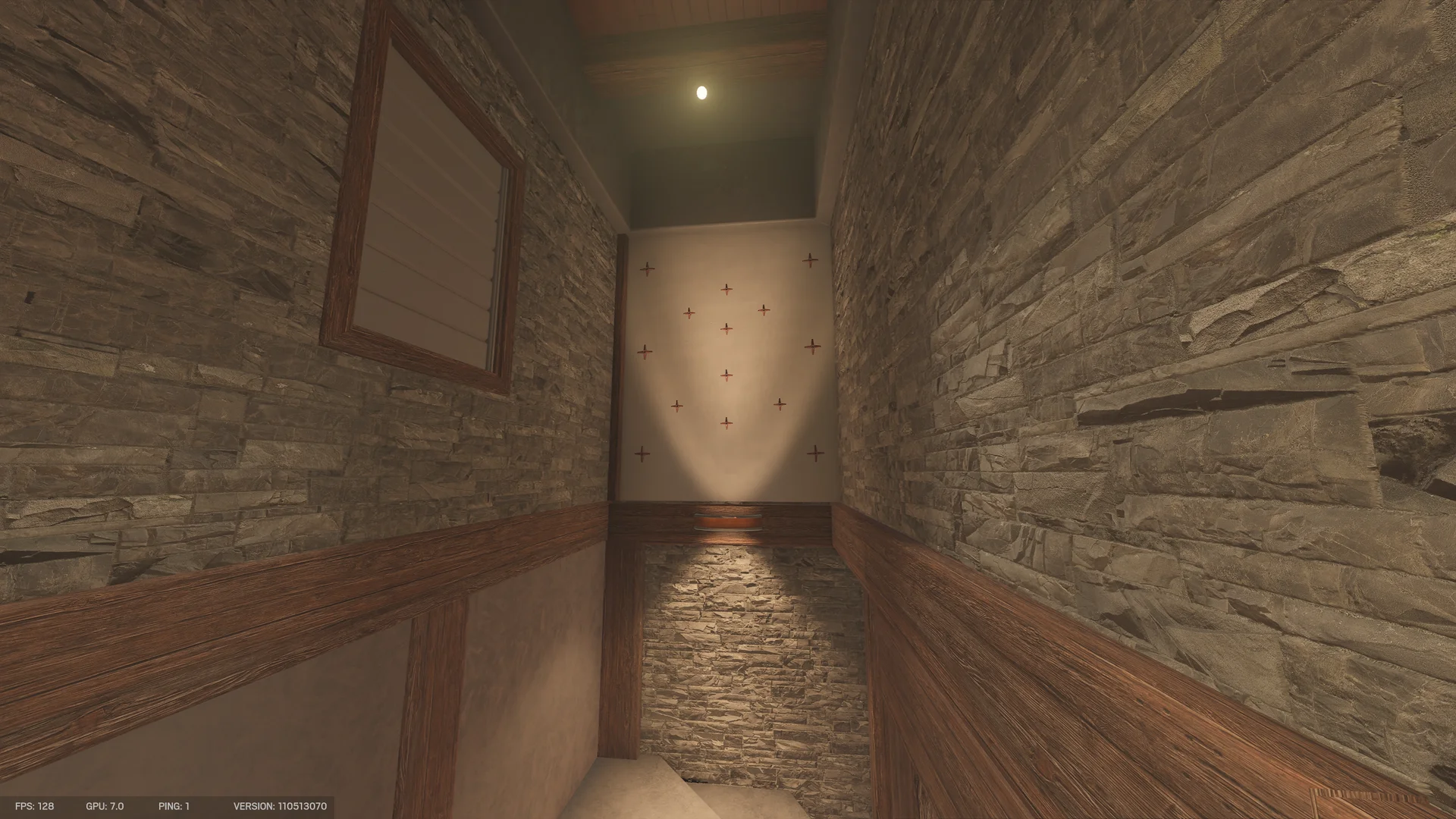 Narrow stone stairwell in the Chalet basement with wooden wainscoting and cross-shaped pegs on the far wall