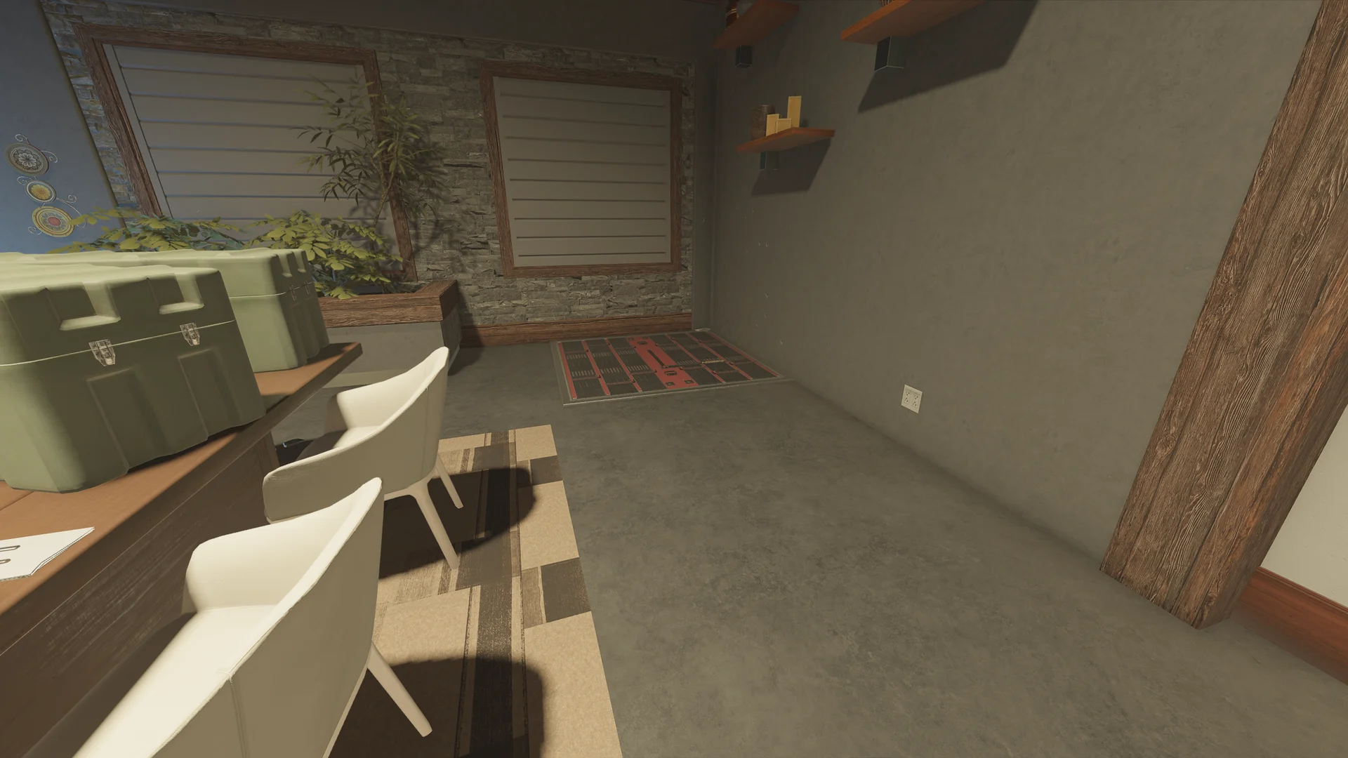 Room on Chalet with green storage cases on a desk, white chairs, and a reinforced floor hatch set into the concrete floor
