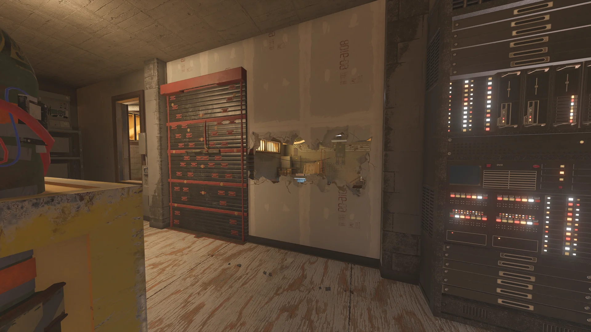 Room on Club House 2F with a reinforced shutter wall, a breach hole in drywall, and a tall rack of electronics with lit LED panels