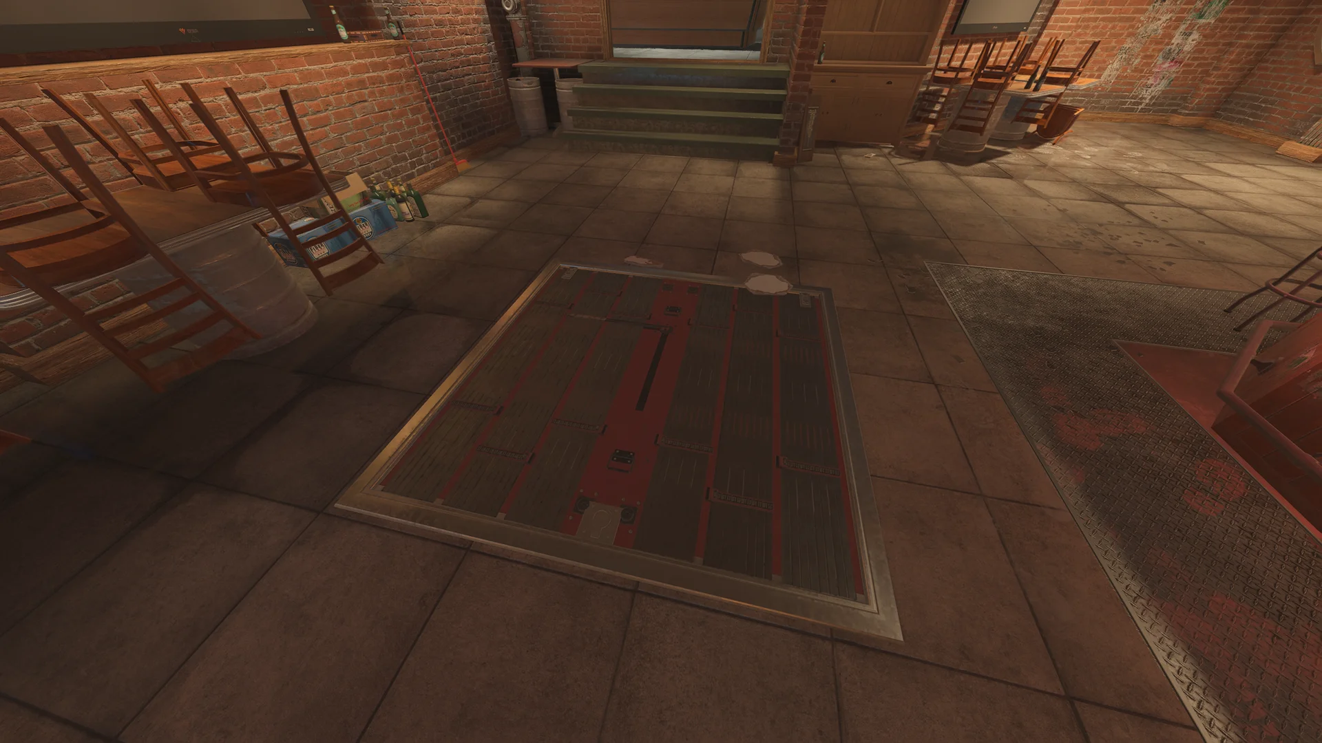 Brick basement room in the Club House with a reinforced floor hatch in the tile floor and stacked wooden chairs and barrels