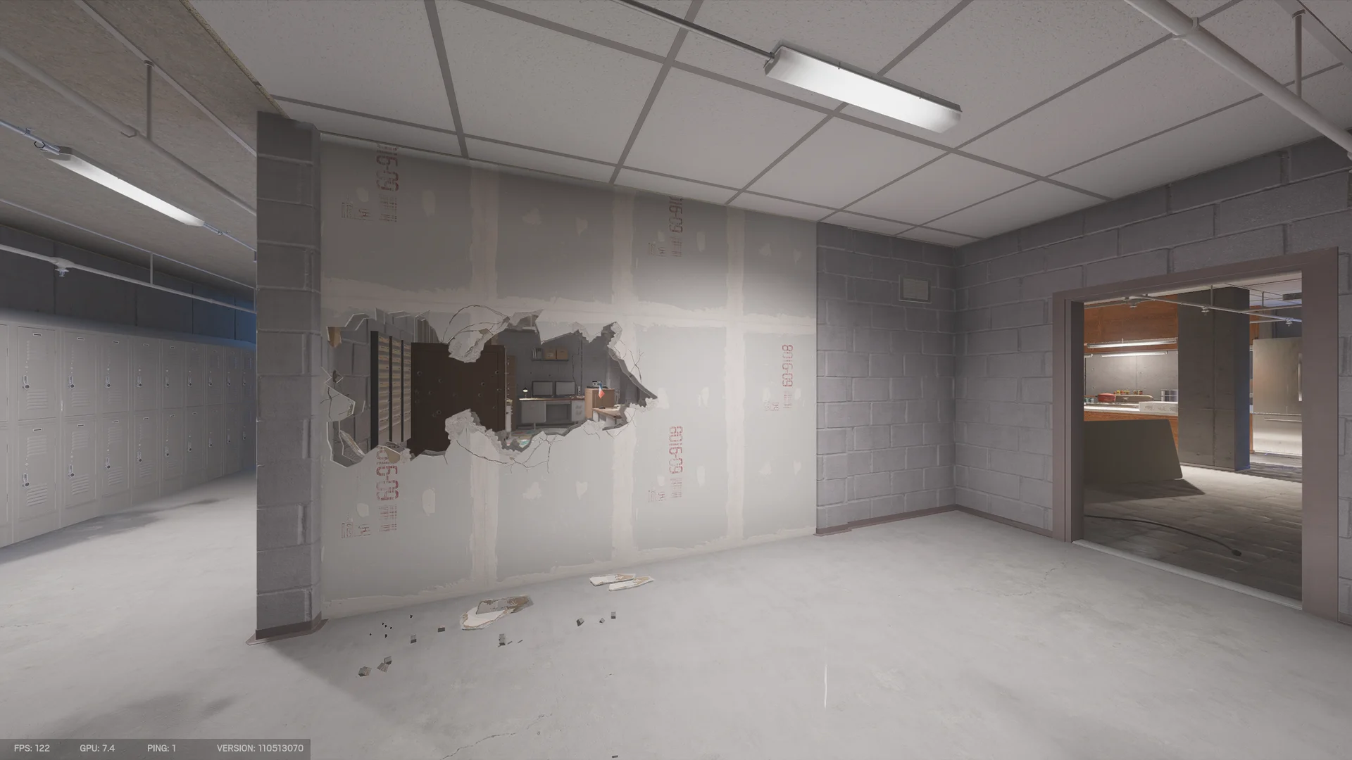 Basement locker room in the Consulate with a row of metal lockers and a large breach hole through a drywall wall into a kitchenette