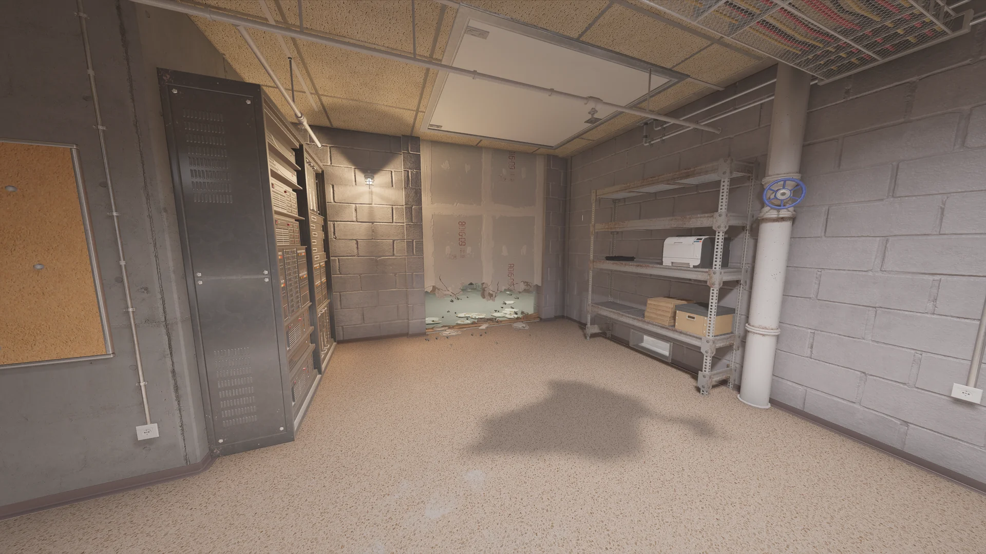 Basement server room in the Consulate with tall server racks, metal shelving, a pipe with a blue valve wheel, and a low breach hole