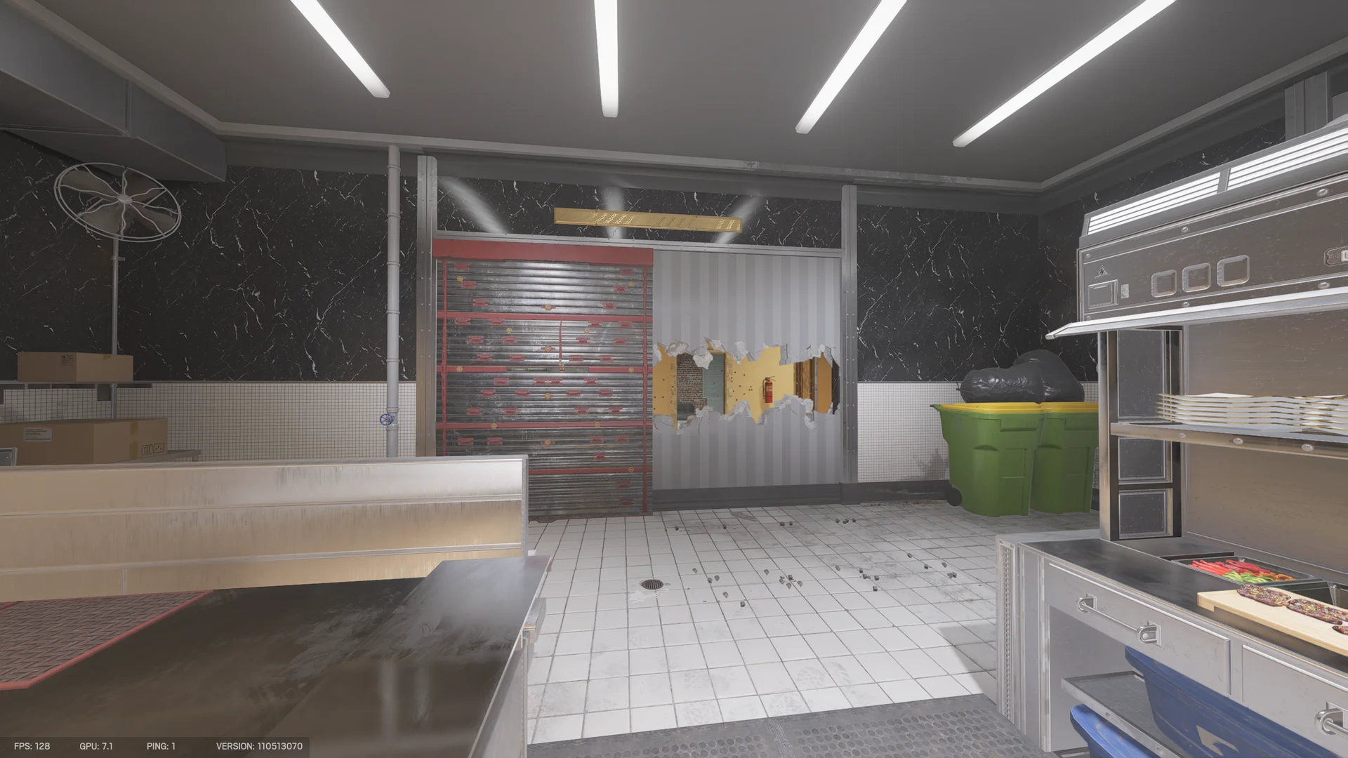 Commercial kitchen on Kafe Dostoyevsky 1F with stainless prep counters, a reinforced shutter, a wall breach hole, a fan, and trash bins
