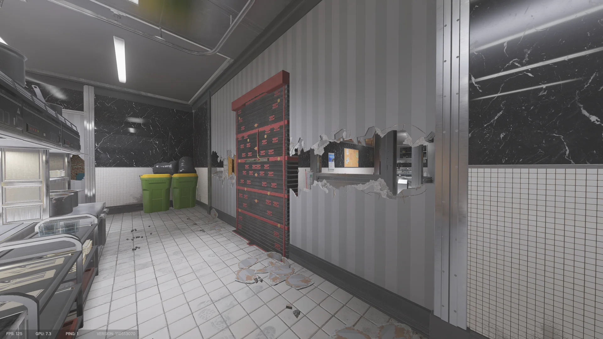 Corridor on Kafe Dostoyevsky 1F with a reinforced shutter, a long breach hole through a wall, trash bins, and a stainless display counter