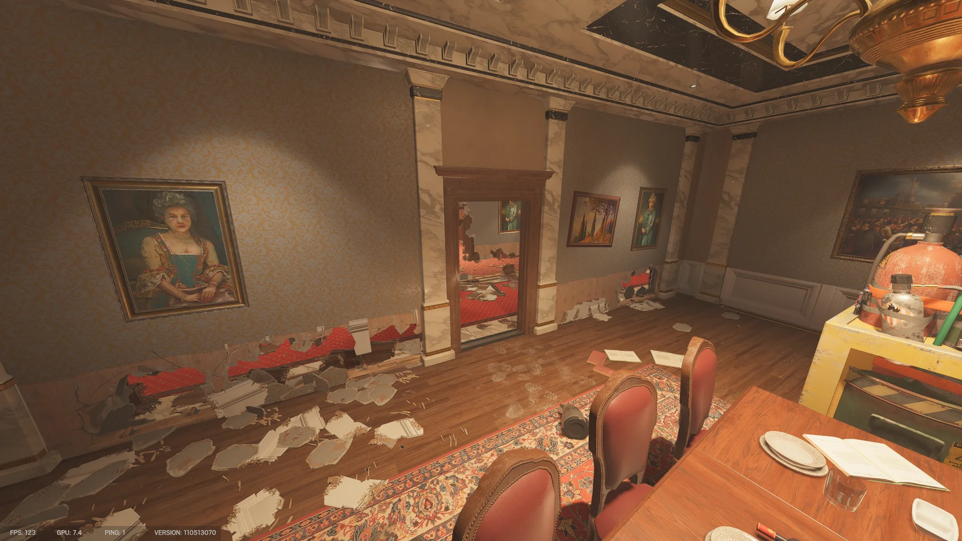 Dining room on Kafe Dostoyevsky 2F with a table and red chairs, framed portraits, a mirrored doorway, and a gas cylinder on a cart