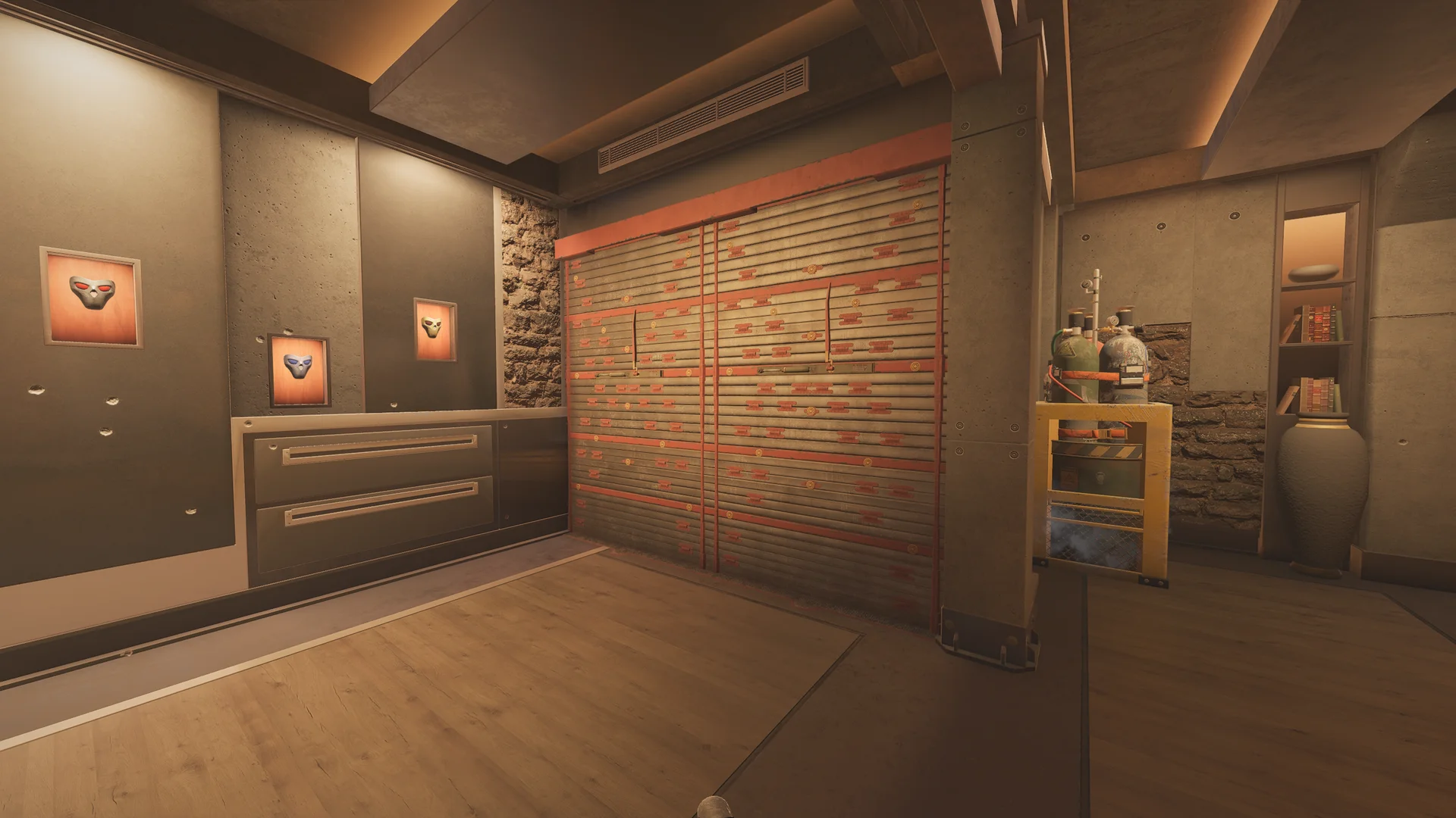 Display room on Lair 2F with framed skull masks in lit recesses, a drawer cabinet, a reinforced shutter, and gas cylinders on a cart