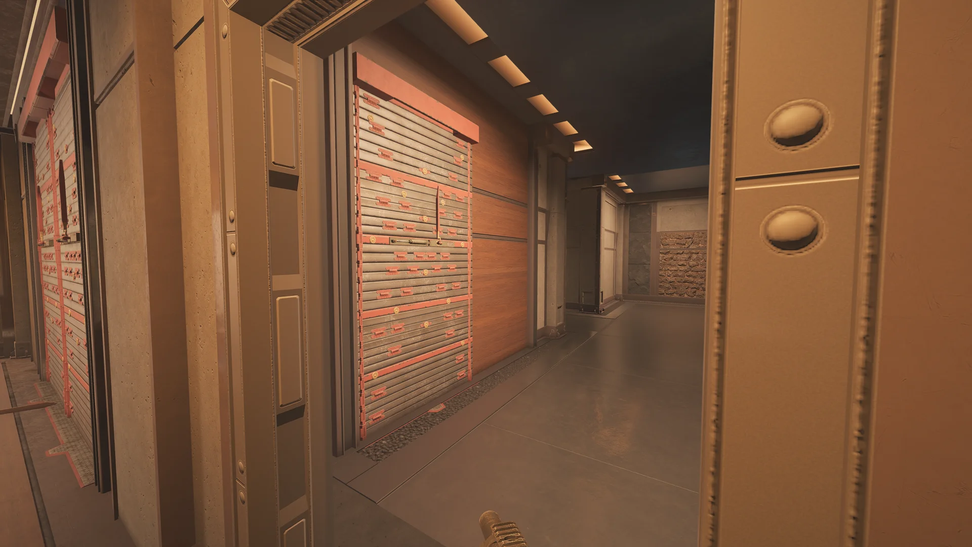 Corridor on Lair 2F with reinforced shutters over wood paneling, strip ceiling lights, a concrete pillar, and a stone accent wall