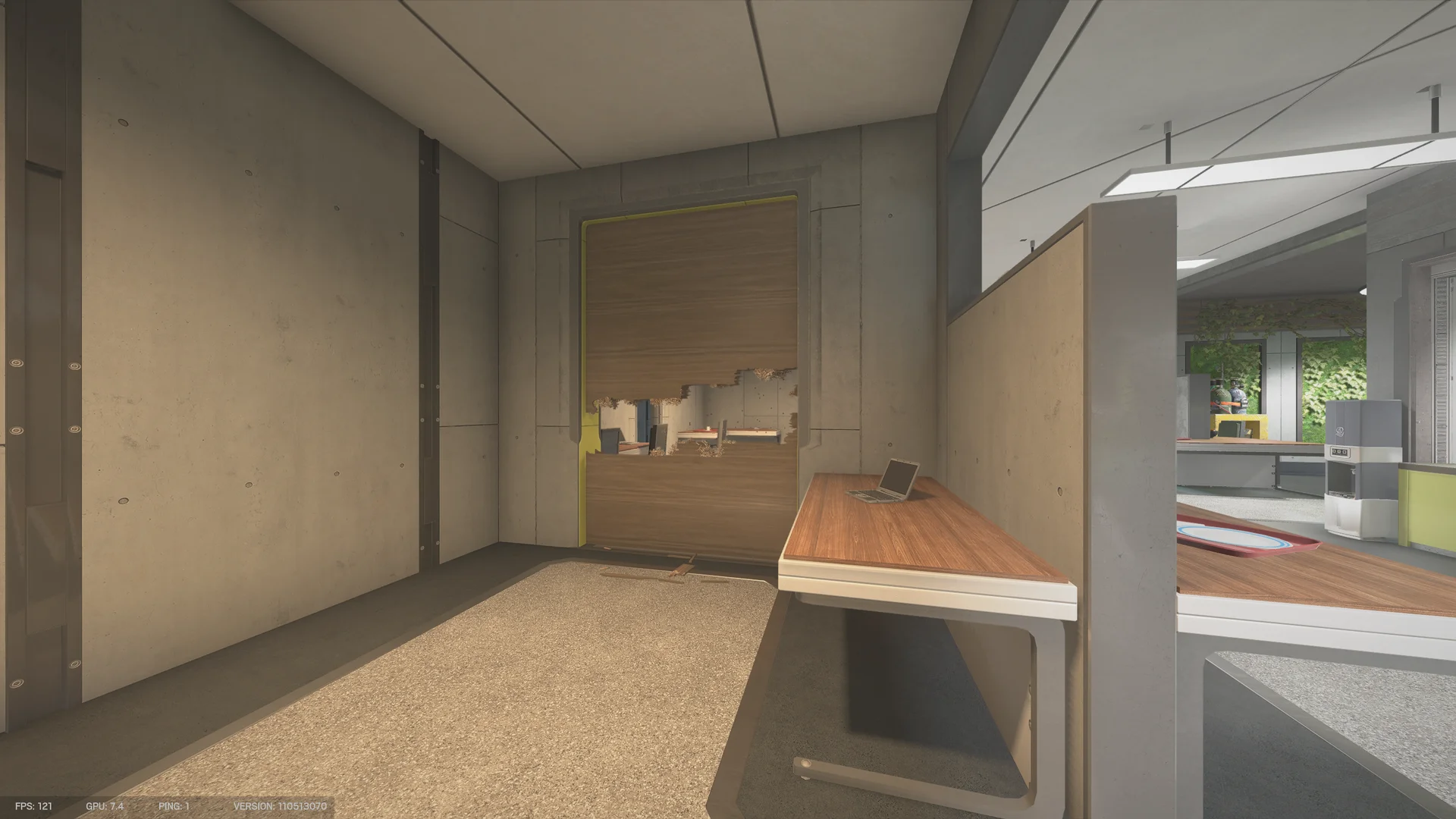 Wooden wall panel with breach holes on Nighthaven Labs 1F, a laptop on a desk at right and an open office area beyond