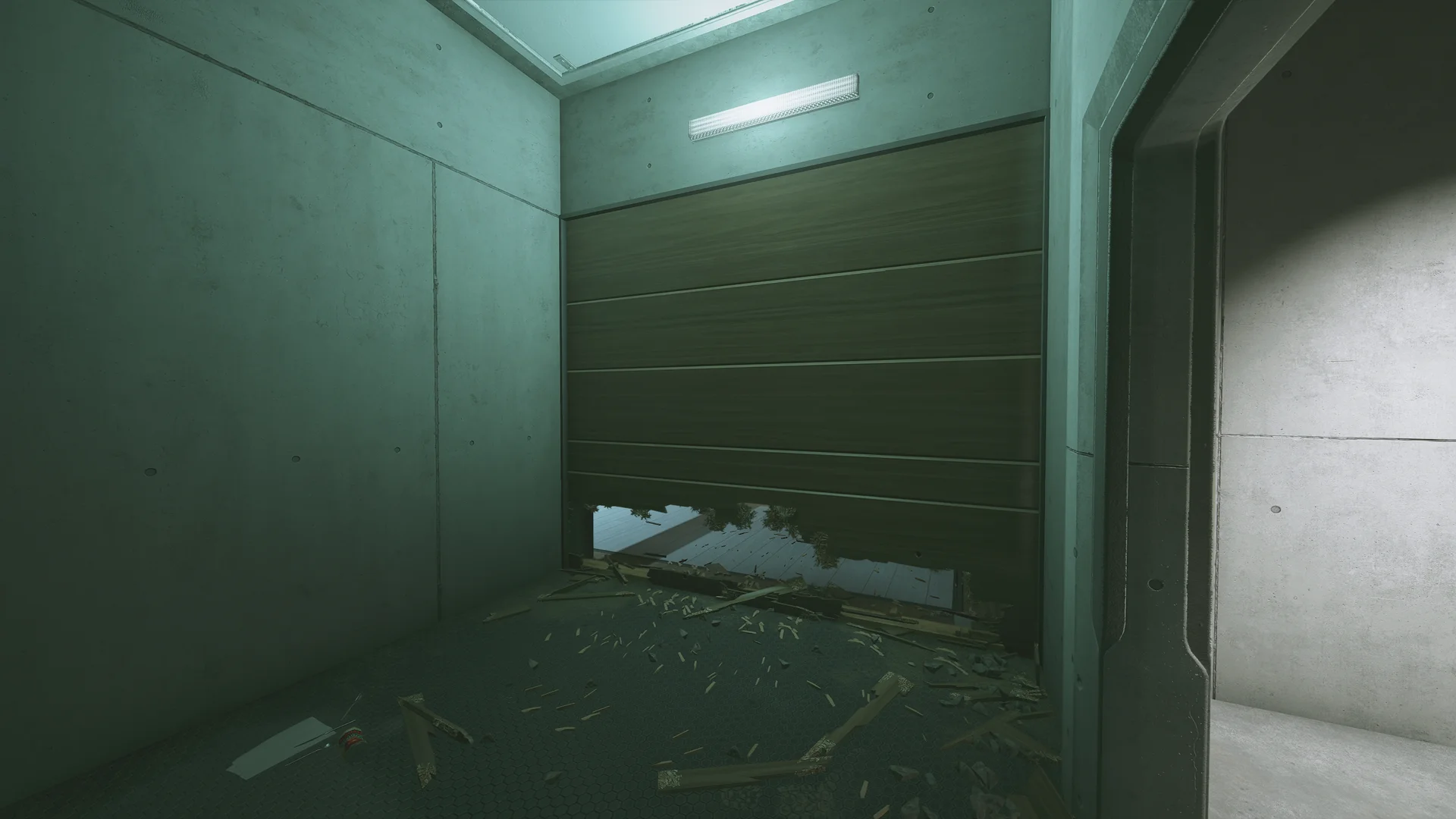 Dimly lit room on Nighthaven Labs 1F with a wooden sectional door breached at floor level and splintered debris scattered