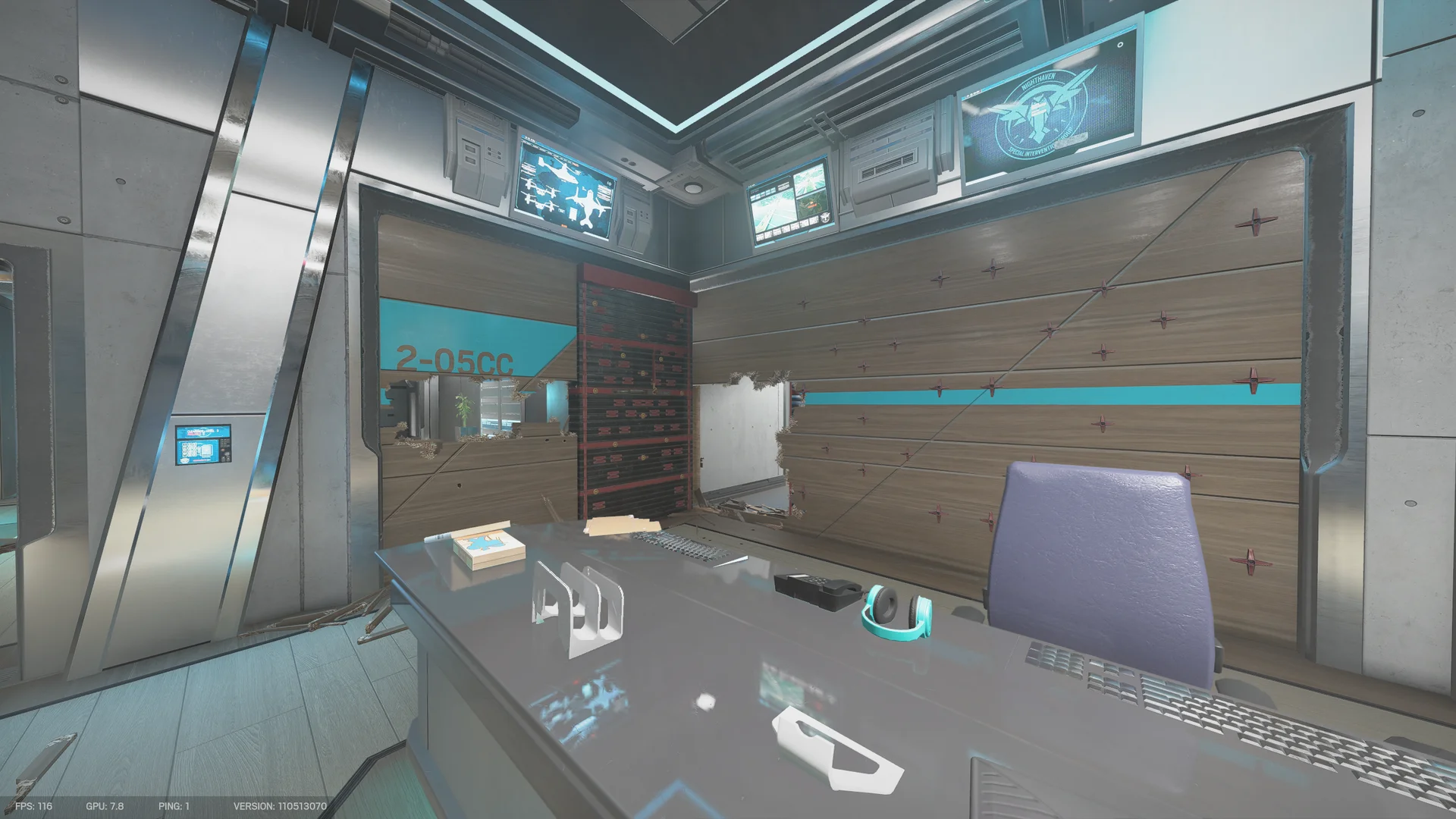 Control room on Nighthaven Labs with wall monitors, a desk with a teal headset and a breached wooden wall beside a shutter