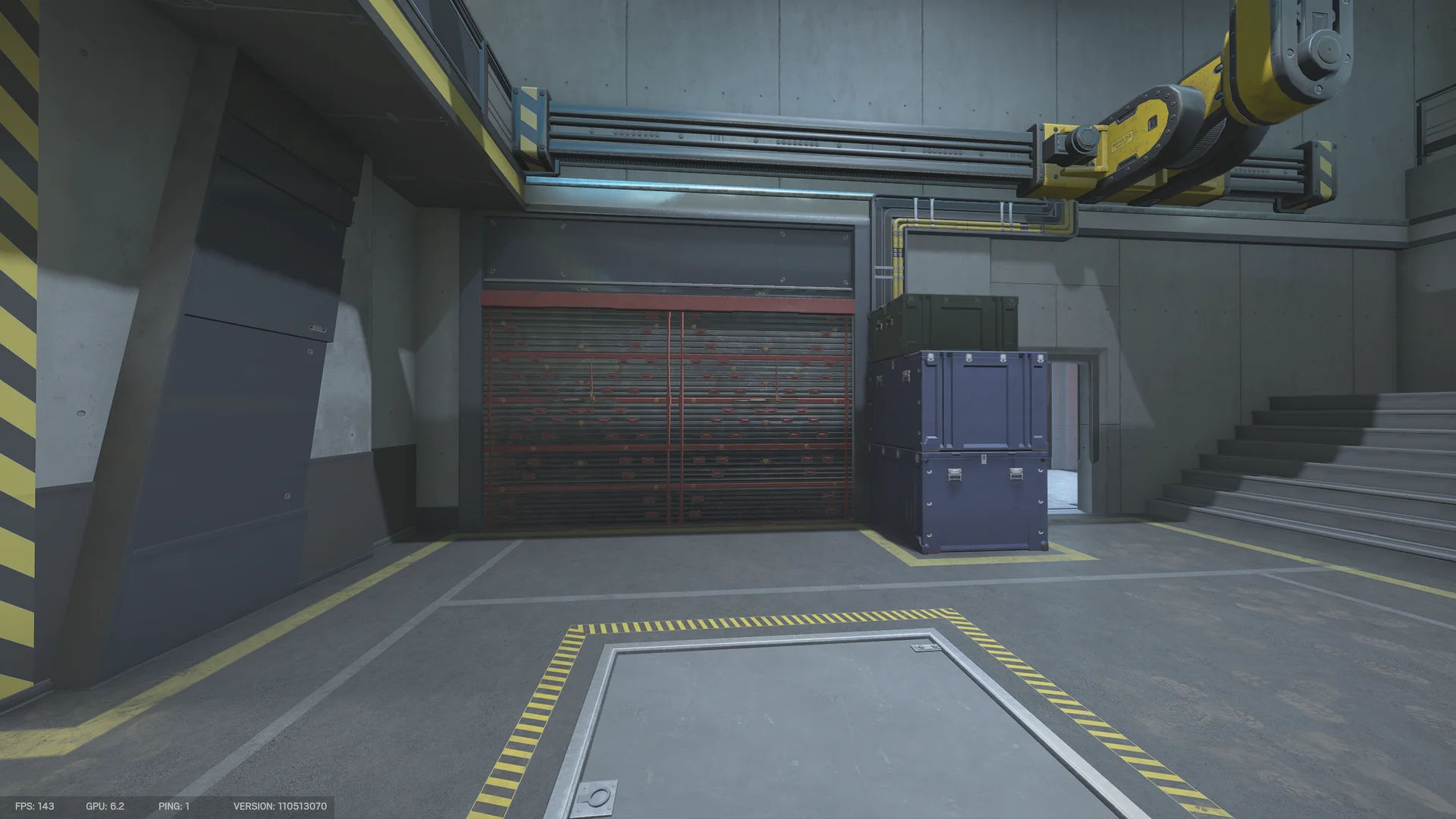 Industrial hall on Nighthaven Labs 1F with a reinforced shutter, stacked crates, a yellow robot arm overhead and a floor hatch