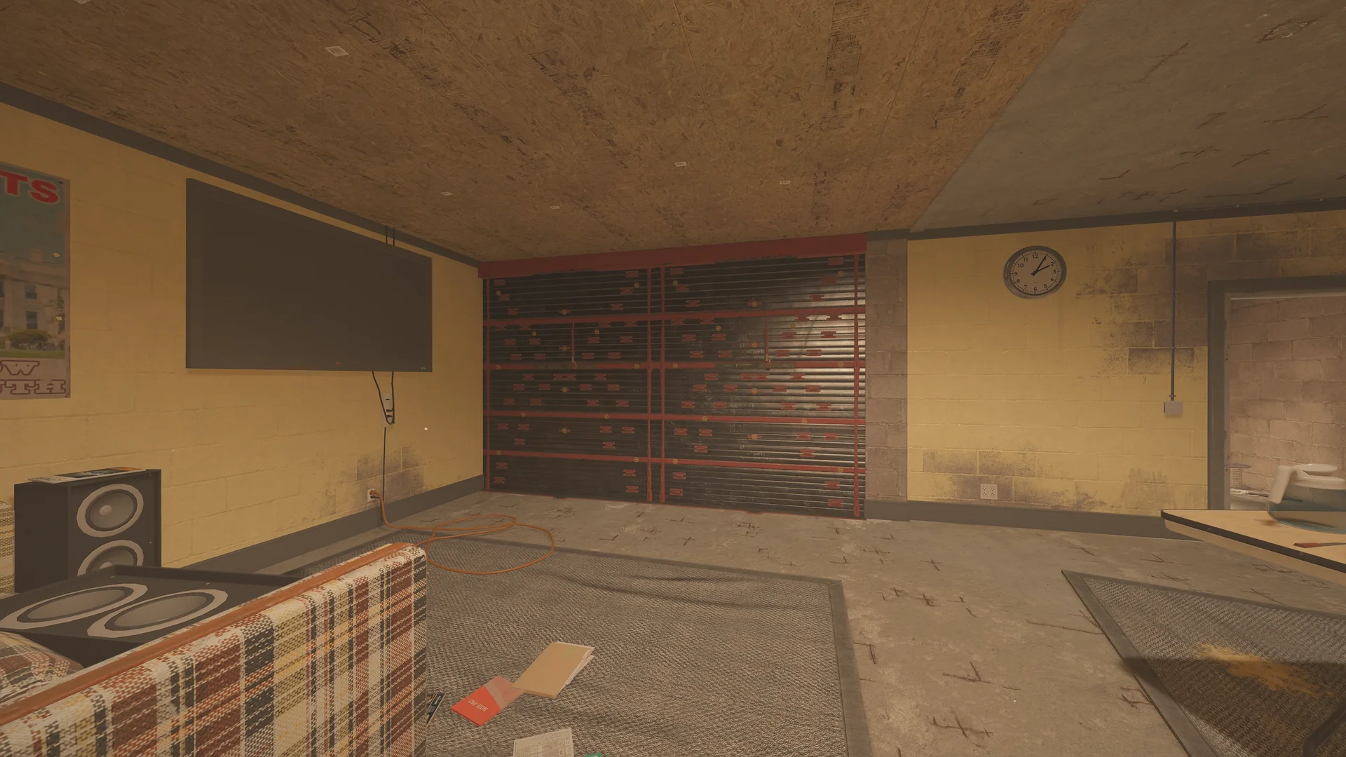 Rec room on Oregon 1F with a wall TV, plaid couch and tower speakers facing a red-and-black reinforced shutter wall
