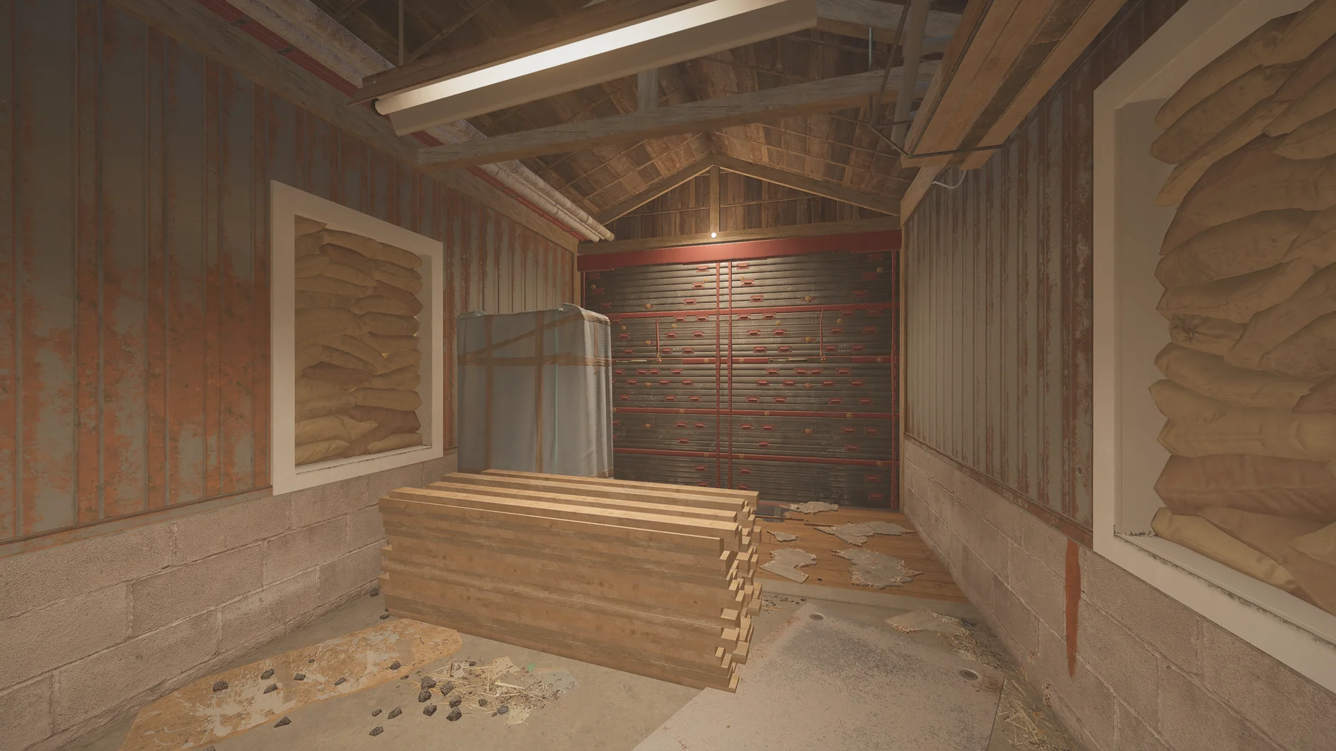 Attic room on Oregon with sandbags stacked in window frames, piled lumber and a red-braced reinforced shutter at the gable
