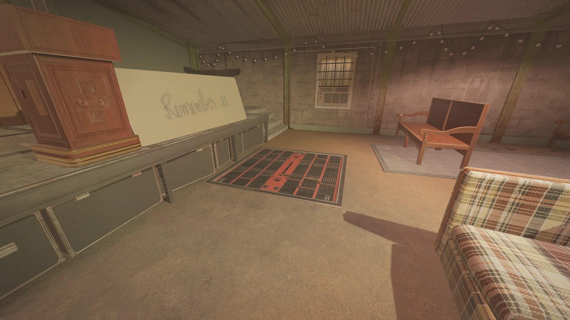 Hall in the Oregon basement with a lectern, a board reading Remember us, a reinforced floor hatch and string lights