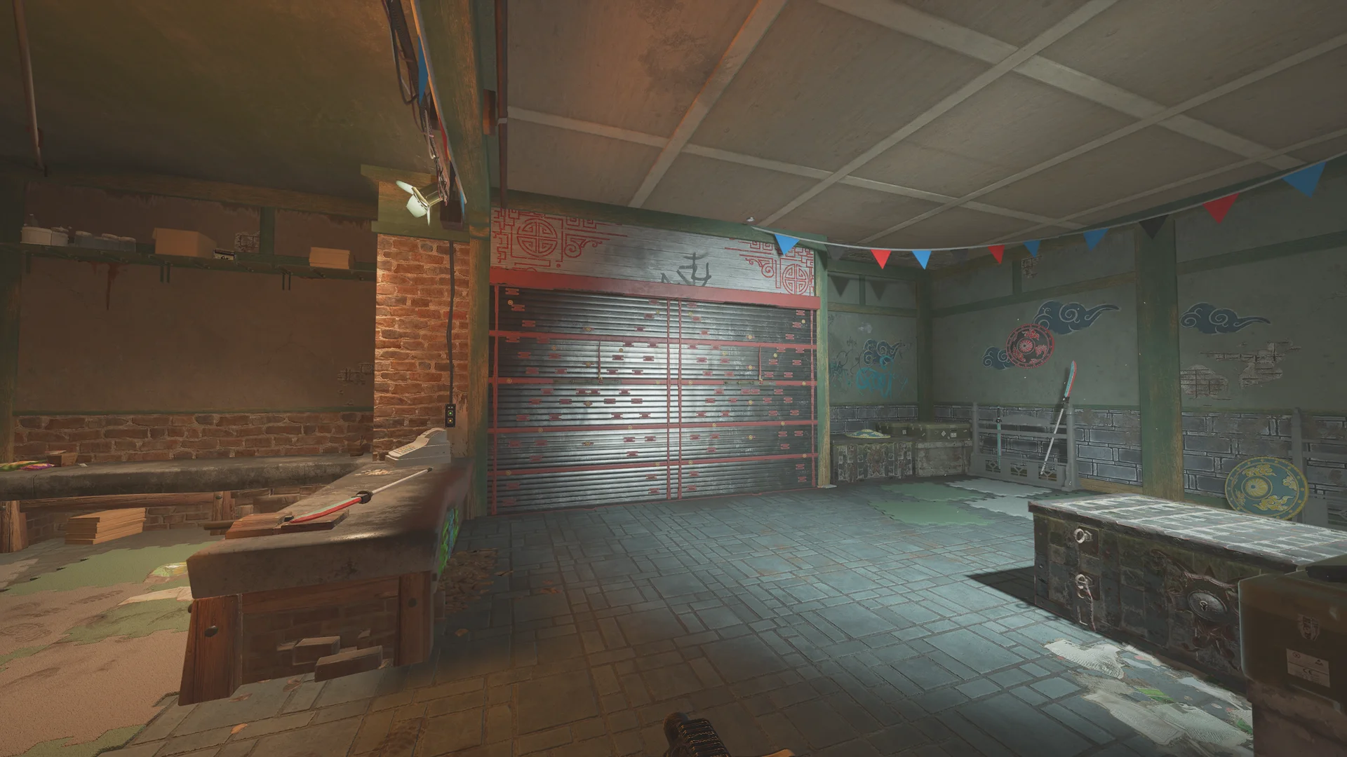 Run-down room on Theme Park 1F with a red-and-black slatted shutter, a workbench, hanging bunting, and dark chests