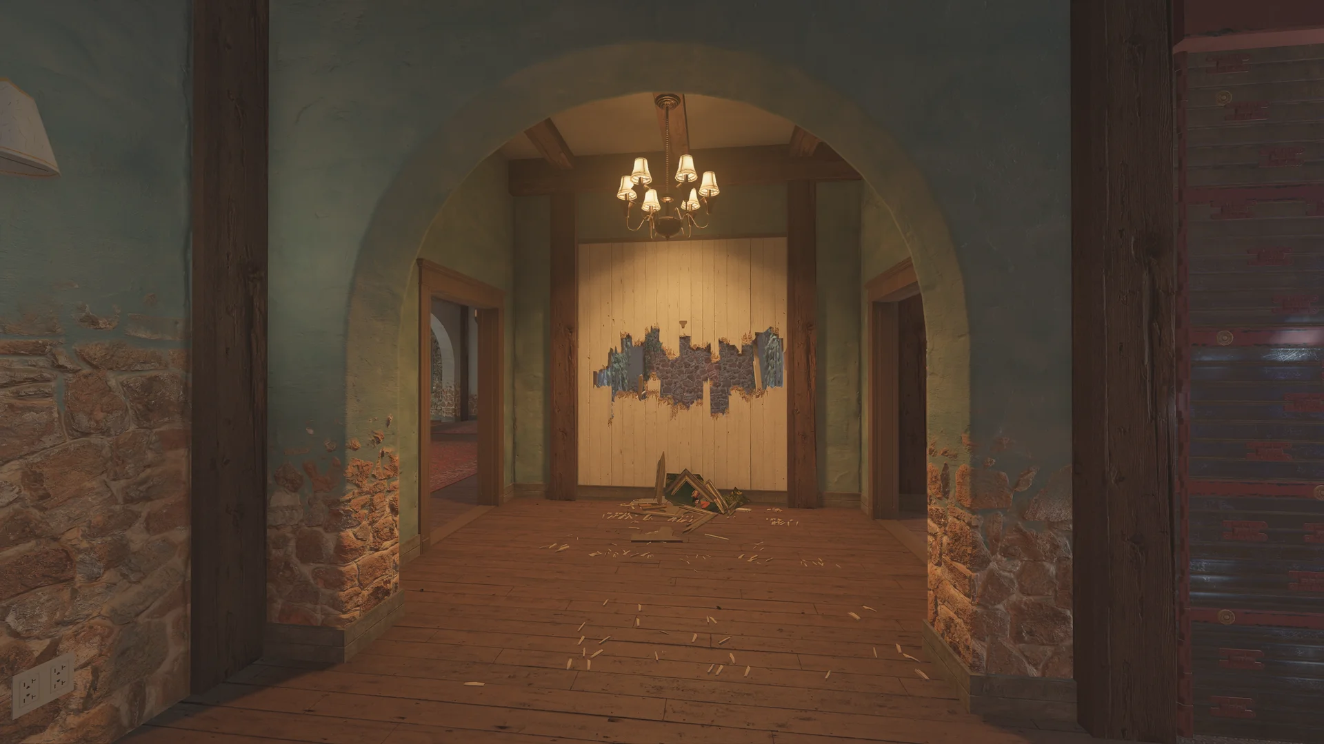 Arched hallway on Villa 2F with a chandelier, stone-based walls, and a large hole broken through a plank wall at the end