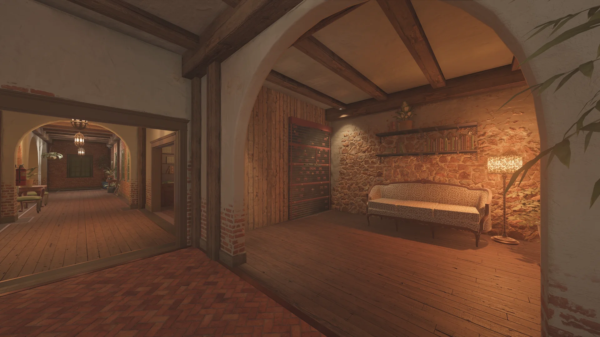 Sitting nook on Villa 2F with a patterned antique sofa on a stone wall, a floor lamp, wall shelves, and an arched entry