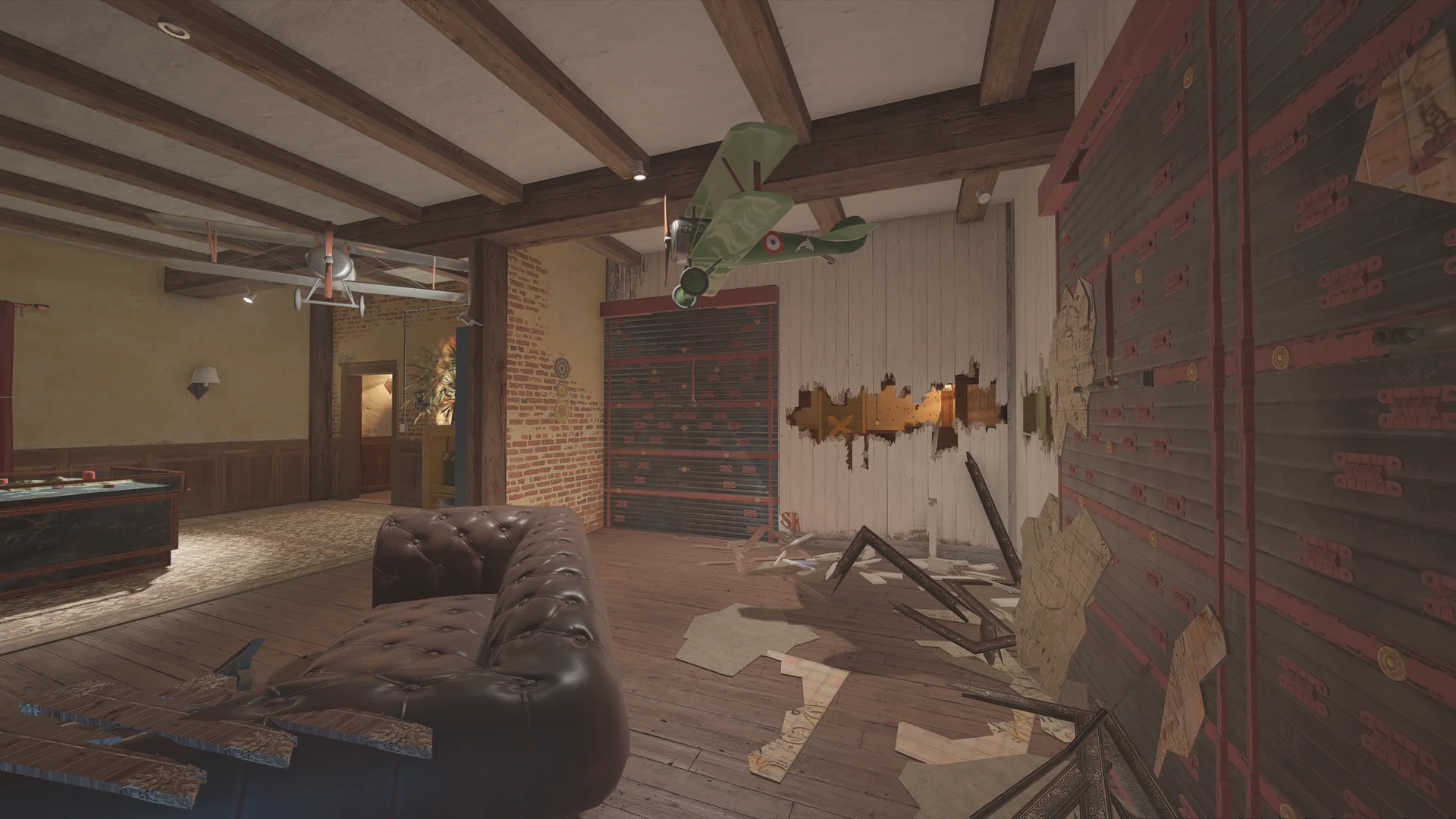 Lounge on Villa 2F with two hanging model biplanes, a tufted leather sofa, slatted shutters, and torn map wallpaper