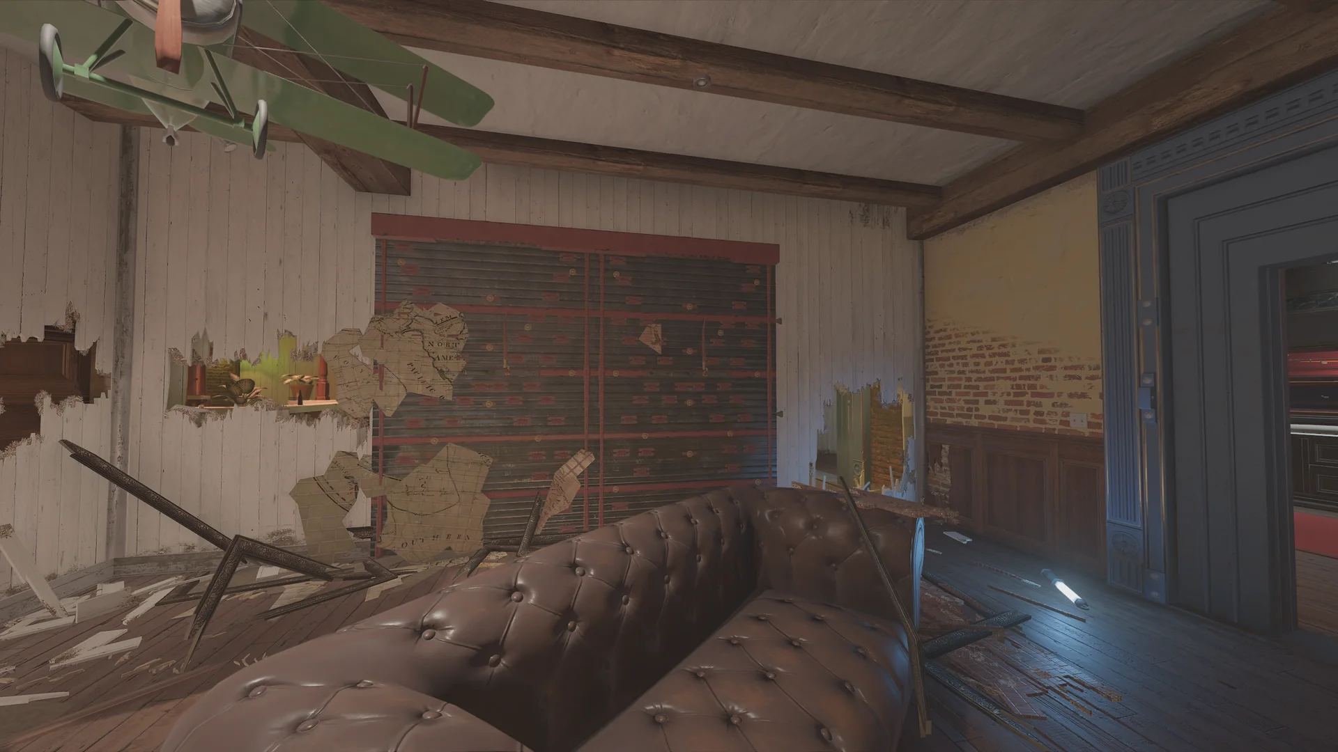 Lounge on Villa 2F with a hanging model biplane, a tufted leather sofa, a slatted shutter, and torn map wallpaper