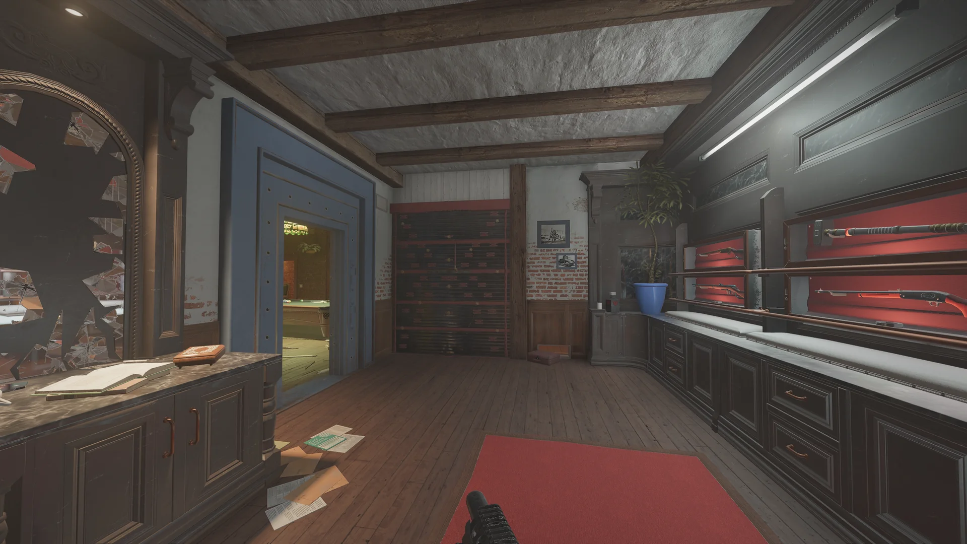 Gun room on Villa 2F with rifles racked on red felt, dark cabinetry, a broken mirror, and a doorway to a billiards room